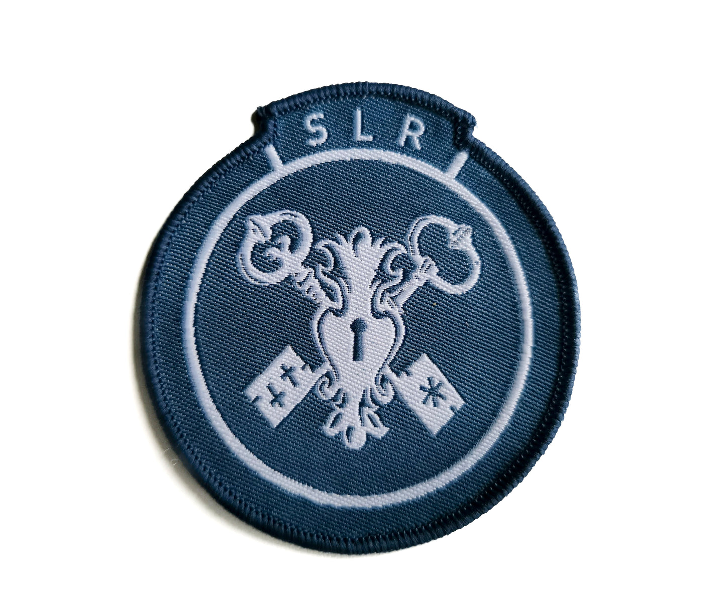 Tygmärke – SLR-logotyp (testprodukt)